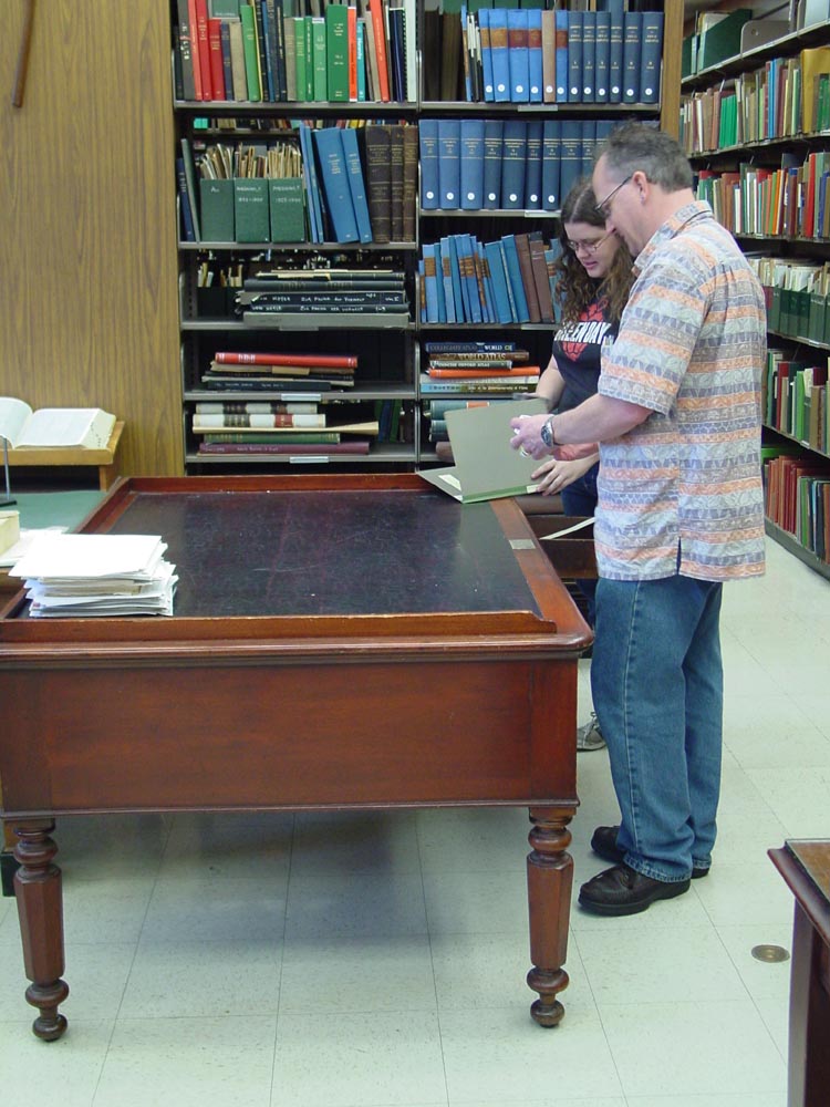 At Edward Drinker Cope's desk in the
                      paleontology library